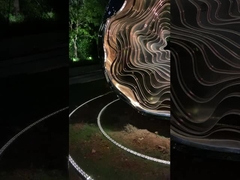 Stainless steel light sculpture at night